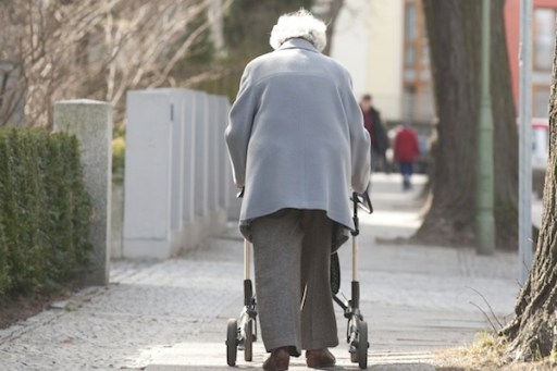 An elderly woman takes a walk near the Agaplesion Bethanien Sophienhaus home for the elderly in Berlin March 23, 2011. The German cabinet has proposed a law that would enable employees to reduce working hours to care for older relatives and get financial compensation from the state. AFP PHOTO / JOHN MACDOUGALL (Photo credit should read JOHN MACDOUGALL/AFP/Getty Images)
