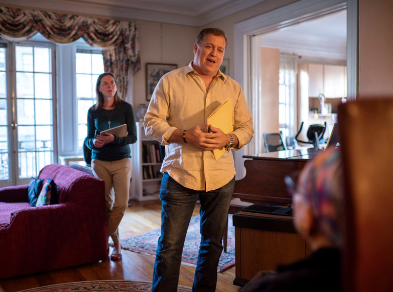At the Manhattan apartment of Dr. Phyllis Harrison-Ross, Robert Berman, an owner of Capo Auction, and Katie Hustead, background, of Paper Moon Moves, a company that specializes in seniors, confer with the client. Dr. Harrison-Ross is moving from her home of 48 years into an apartment building tailored to seniors. Credit Emon Hassan for The New York Times
